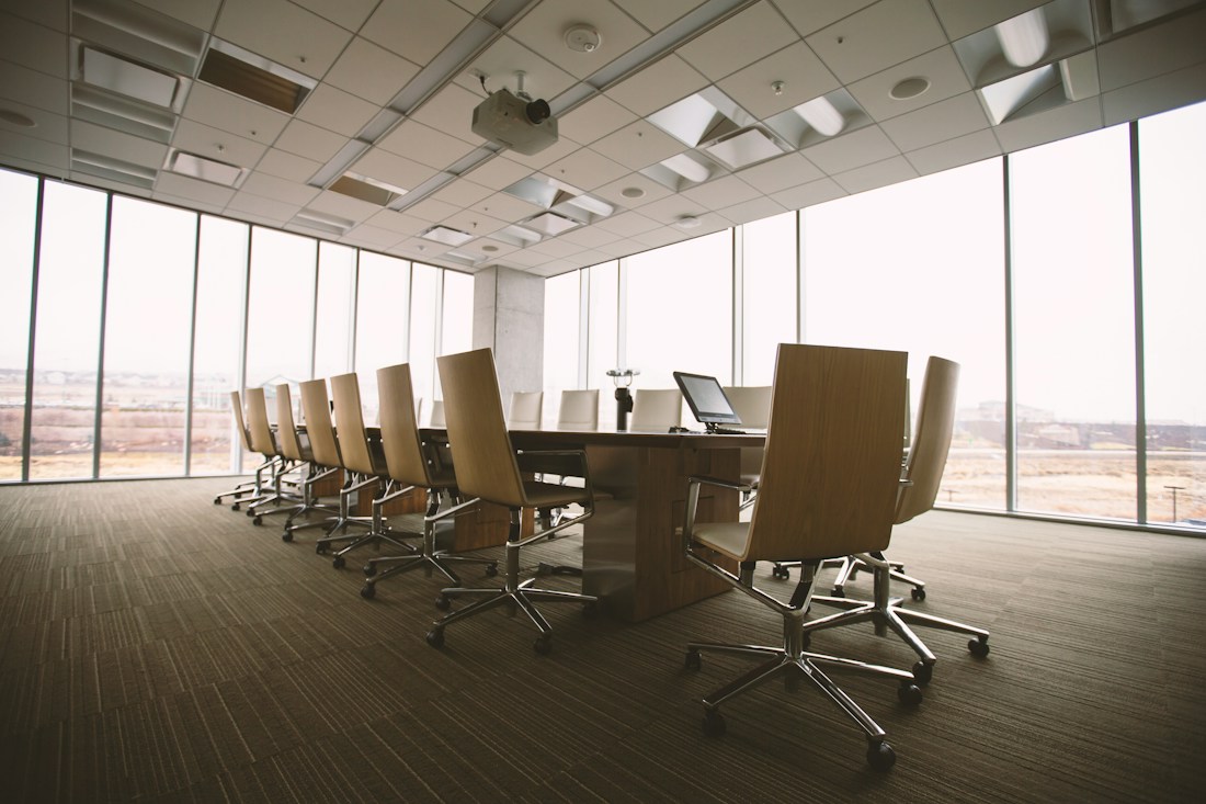 Minimalist executive boardroom with glass and professional furniture
